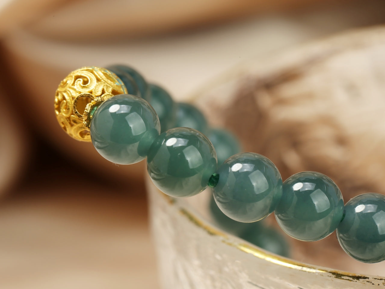 blue - water jadeit and hollow gold bead bracelet.