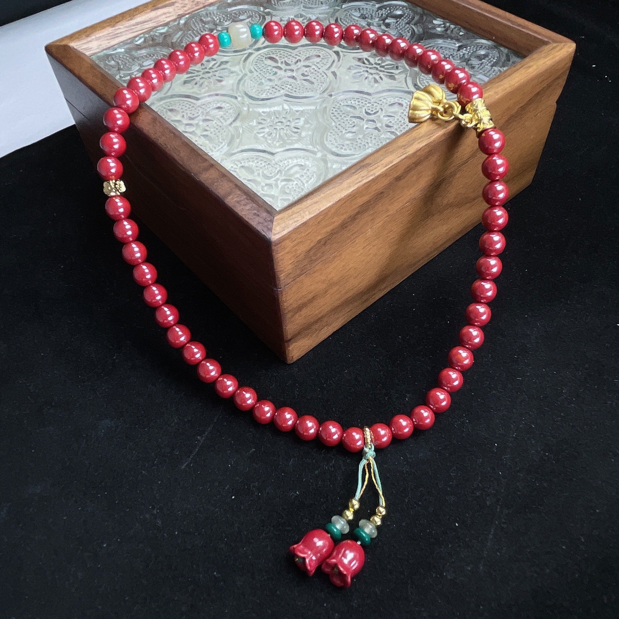 cinnabar design bead string