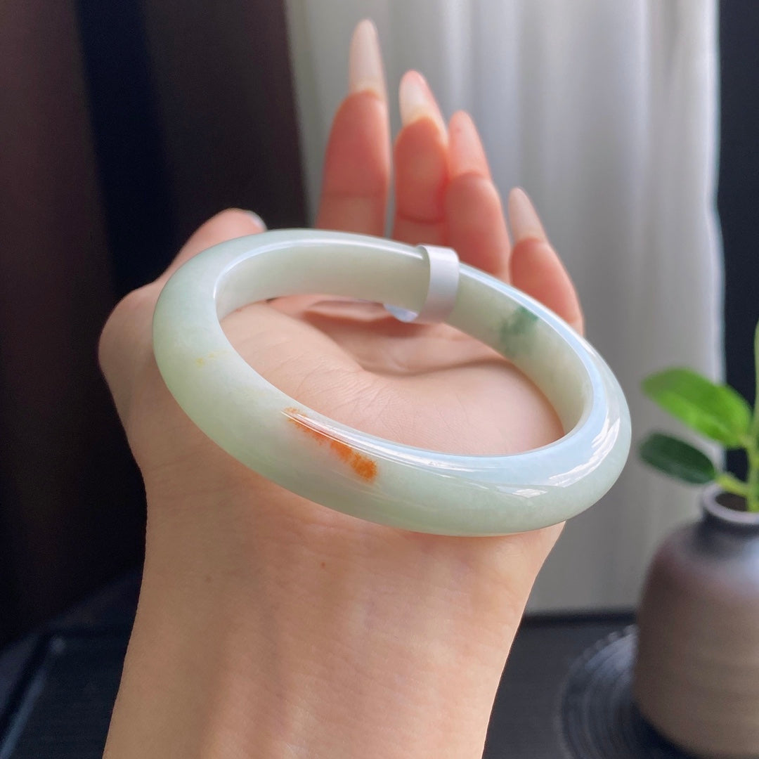 Light Green Jadeite Bangle with Drifting Patterns