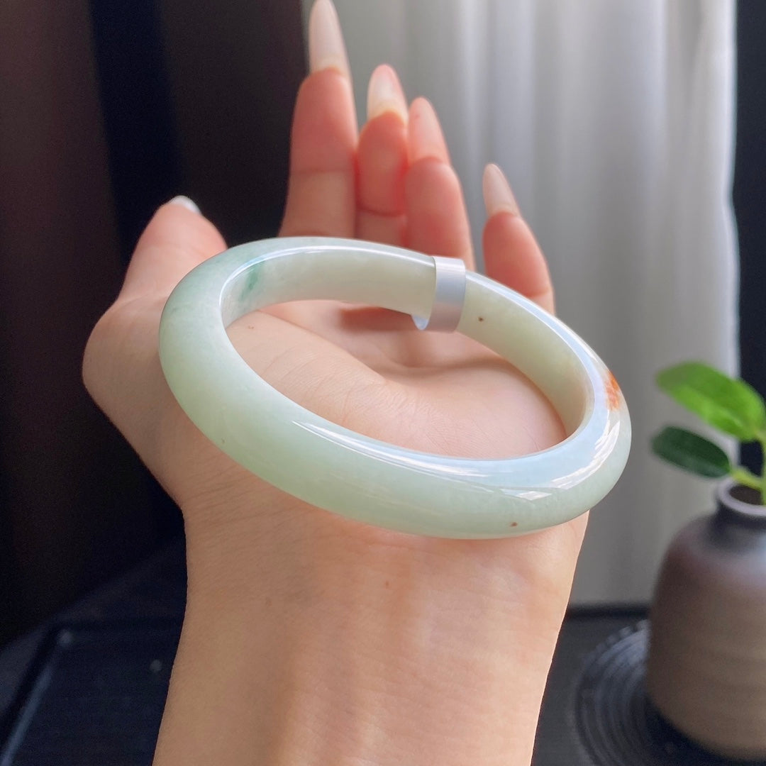 Light Green Jadeite Bangle with Drifting Patterns