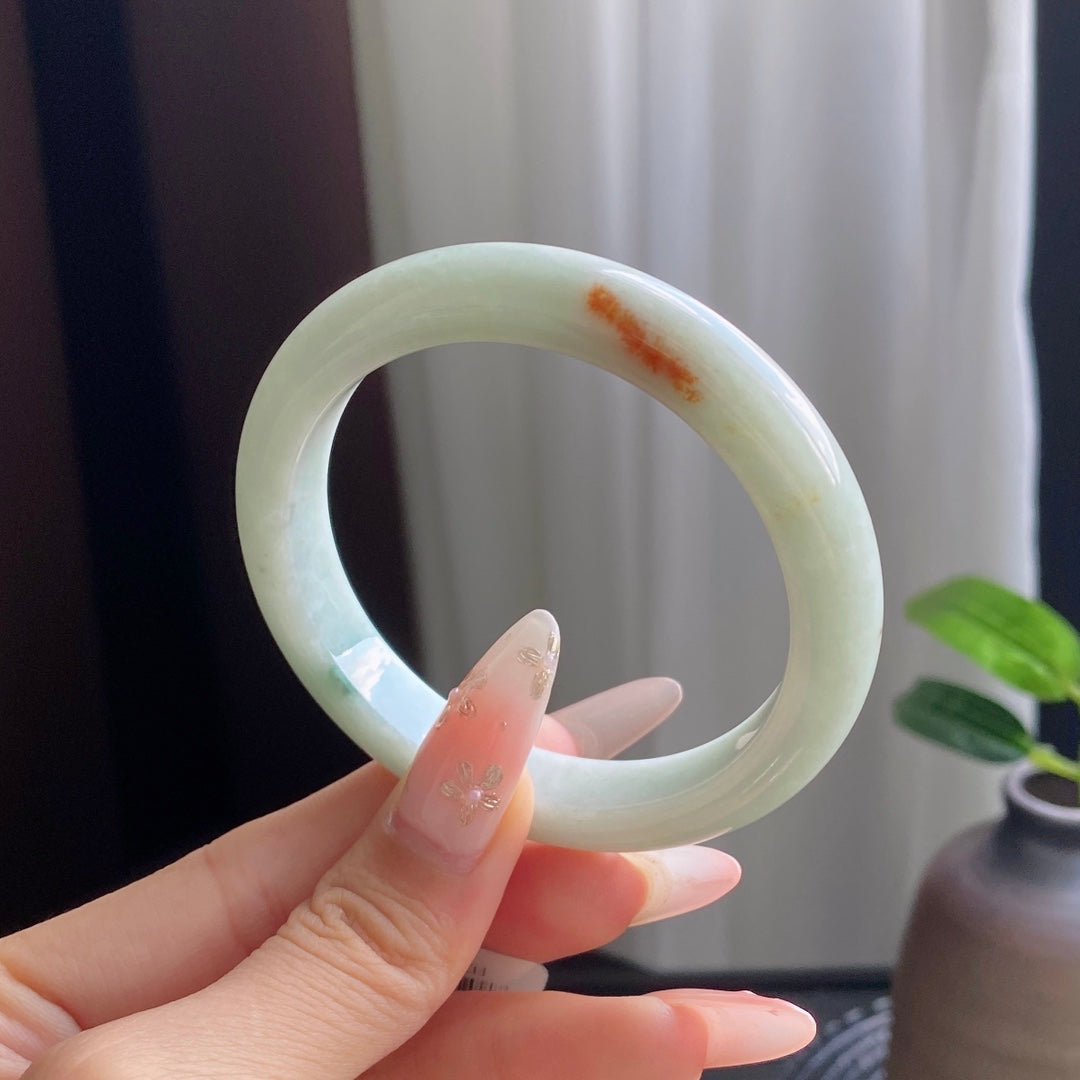 Light Green Jadeite Bangle with Drifting Patterns