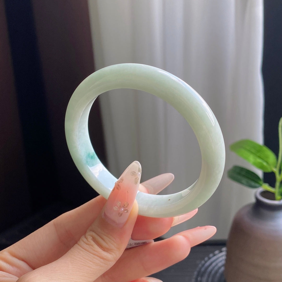 Light Green Jadeite Bangle with Drifting Patterns