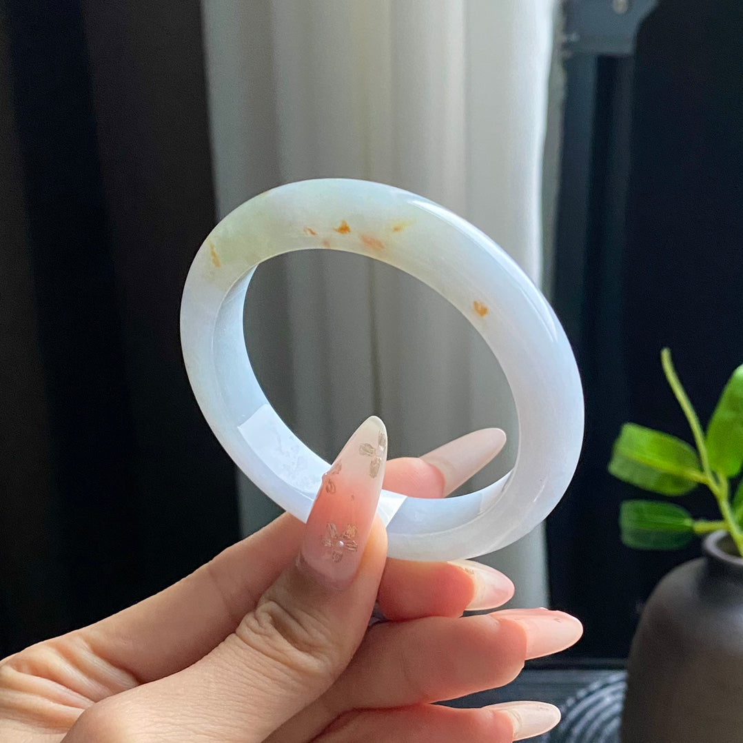 Jadeite Bangle with Drifting Green and Gold Spots