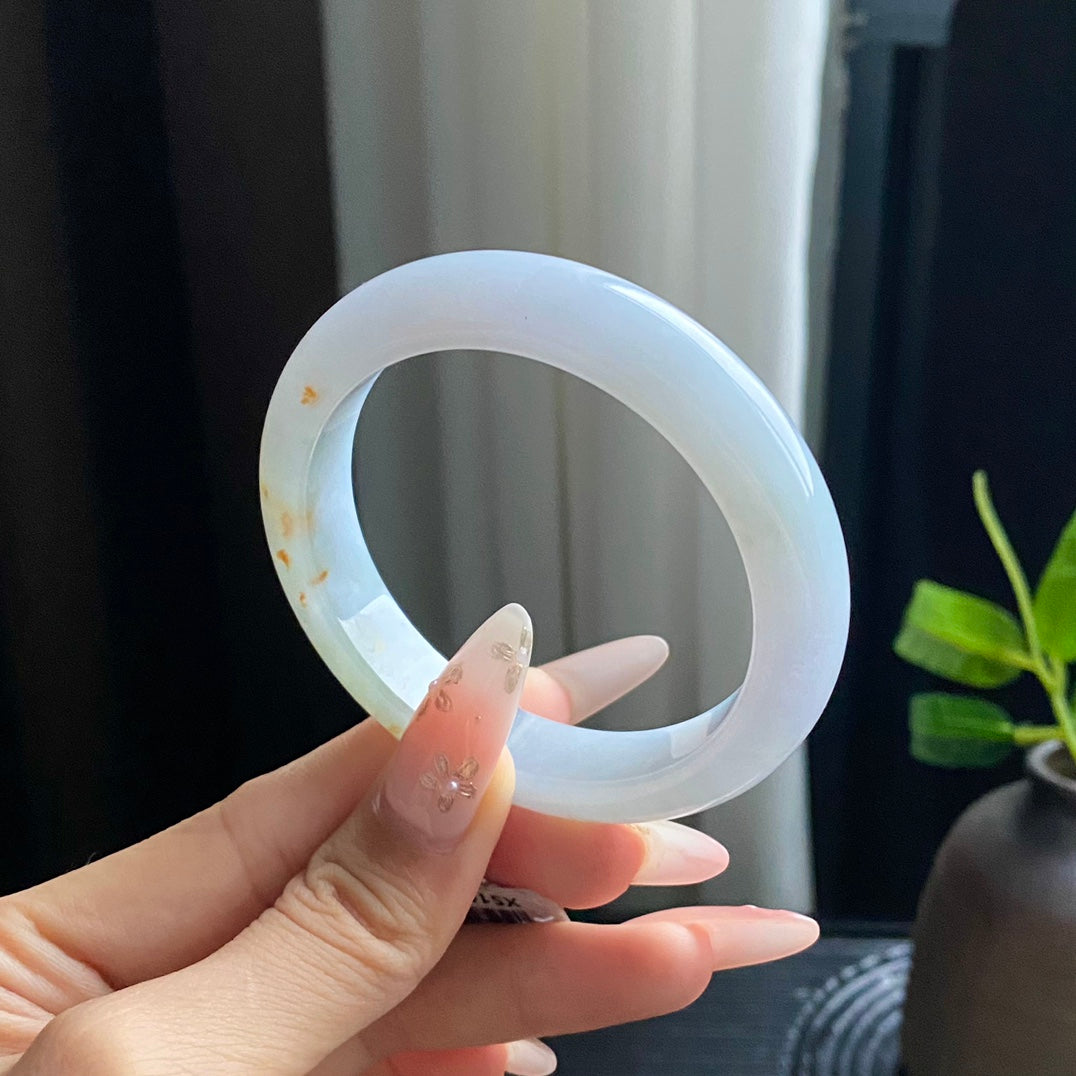 Jadeite Bangle with Drifting Green and Gold Spots