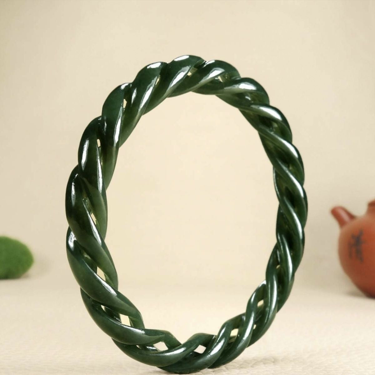 “Elegant Natural Hetian Jade Green Bangle – Hand-Carved Twist Design, Ice-Type Texture, Symbol of Grace and Serenity